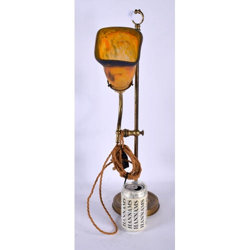 573 - AN ART DECO MULLER FRERES GLASS AND BRASS ADJUSTABLE LAMP. 50 cm high.