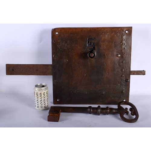 575 - A HUGE EARLY CONTINENTAL CAST IRON LOCK AND KEY. 66 cm x 40 cm.