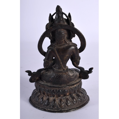 60 - A 19TH CENTURY INDIAN TIBETAN BRONZE FIGURE OF A SEATED BUDDHA modelled upon a triangular base. 12 c... 