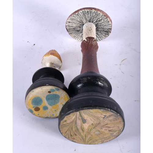 603 - TWO FOLK ART CARVED AND PAINTED WOOD MUSHROOM SPECIMENS. Largest 16 cm high. (2)