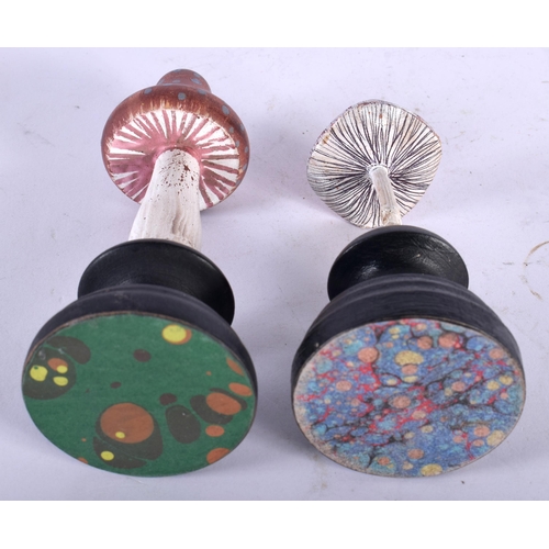 604 - TWO FOLK ART CARVED AND PAINTED WOOD MUSHROOM SPECIMENS. Largest 14 cm high. (2)