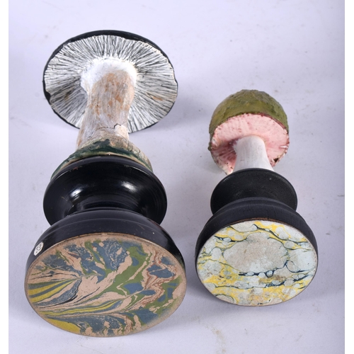 605 - TWO FOLK ART CARVED AND PAINTED WOOD MUSHROOM SPECIMENS. Largest 14 cm high. (2)