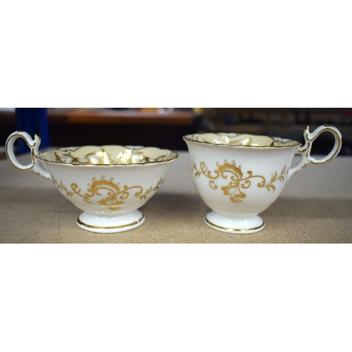 629 - AN EARLY 19TH CENTURY ENGLISH PORCELAIN CREAM AND GILT PORCELAIN TEASET. Largest 23 cm x 10 cm. (12)