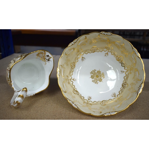 629 - AN EARLY 19TH CENTURY ENGLISH PORCELAIN CREAM AND GILT PORCELAIN TEASET. Largest 23 cm x 10 cm. (12)