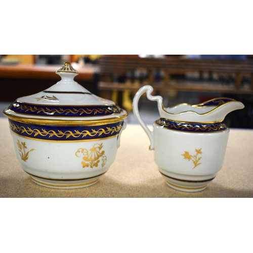 631 - A LATE 18TH CENTURY BARR WORCESTER PORCELAIN TEASET painted with blue and gilt foliage. Largest 22 c... 