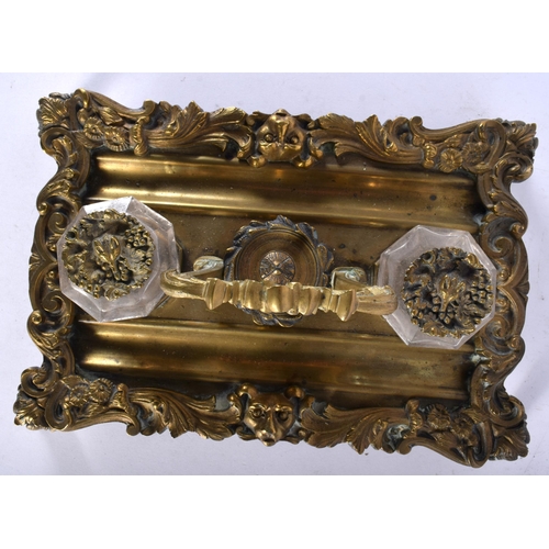 637 - AN EARLY 19TH CENTURY ENGLISH GILT BRONZE AND CUT GLASS DESK STAND the inkwells covered with hidden ... 