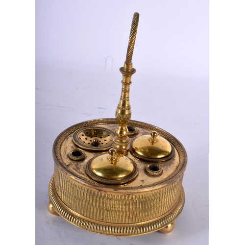 64 - AN EARLY 19TH CENTURY FRENCH EMPIRE ORMOLU DESK STAND containing two inkwells and a removable desk s... 