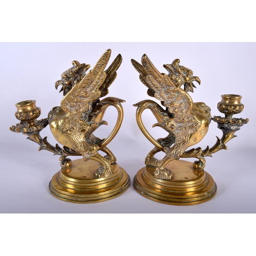 649 - A PAIR OF 19TH CENTURY FRENCH BRONZE GRIFFIN CANDLESTICKS modelled upon stepped bases. 22 cm x 15 cm... 