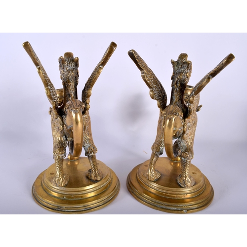 649 - A PAIR OF 19TH CENTURY FRENCH BRONZE GRIFFIN CANDLESTICKS modelled upon stepped bases. 22 cm x 15 cm... 