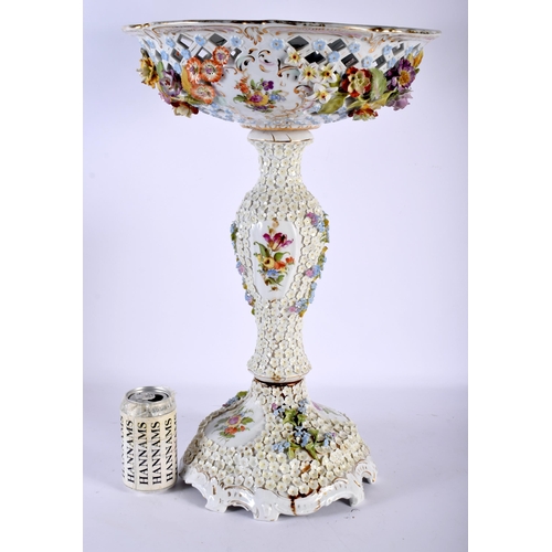 65 - A LARGE EARLY 20TH CENTURY GERMAN PORCELAIN ENCRUSTED COMPORT painted with flowers. 53 cm x 23 cm.