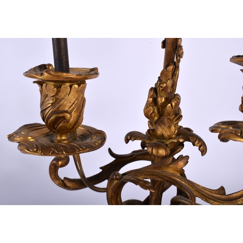 650 - AN EARLY 19TH CENTURY FRENCH ORMOLU TABLE SCREEN LAMP of scrolling rococo form. 52 cm x 15 cm.