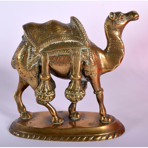 652 - AN ANTIQUE INDIAN BRONZE CAMEL together with a leather camel. Largest 33 cm wide. (2)