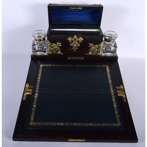 655 - A LARGE EARLY VICTORIAN COROMANDEL BRASS BOUND WRITING SLOPE modelled in the Gothic manner. 35 cm x ... 