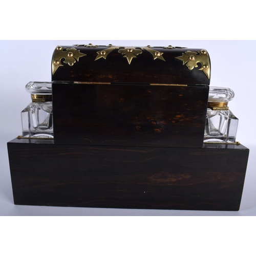 655 - A LARGE EARLY VICTORIAN COROMANDEL BRASS BOUND WRITING SLOPE modelled in the Gothic manner. 35 cm x ... 