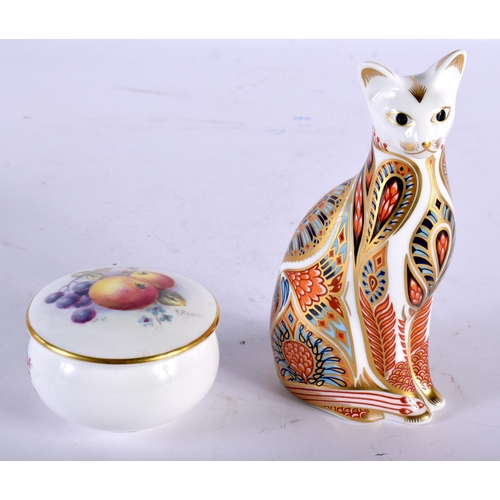 66 - A SMALL ROYAL WORCESTER PILL BOX by Banks, together with a Crown Derby imari cat paperweight. Larges... 