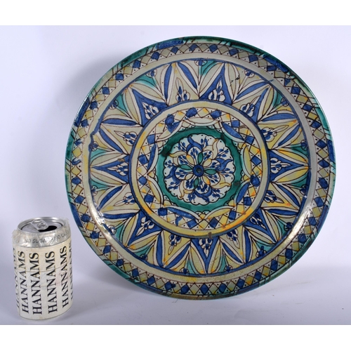 662 - A LARGE ANTIQUE FAIENCE MOROCCAN POTTERY PEDESTAL BOWL painted with flowers. 35 cm diameter.