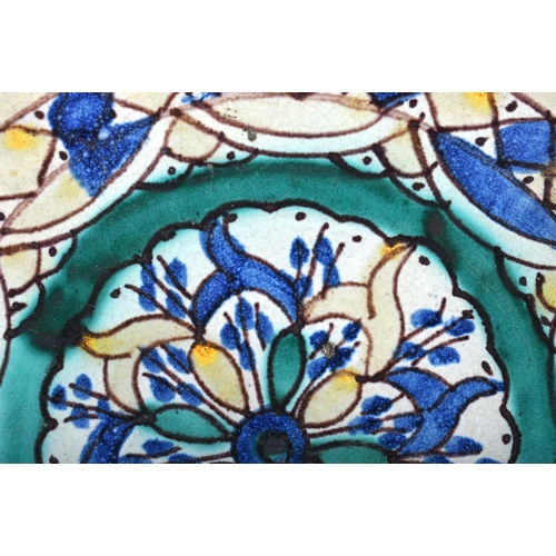 662 - A LARGE ANTIQUE FAIENCE MOROCCAN POTTERY PEDESTAL BOWL painted with flowers. 35 cm diameter.