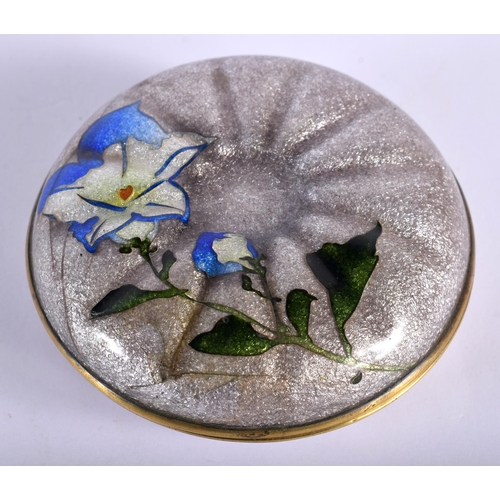 67 - AN EARLY 20TH CENTURY CONTINENTAL ENAMEL BOX AND COVER decorative with flowers. 9 cm diameter.