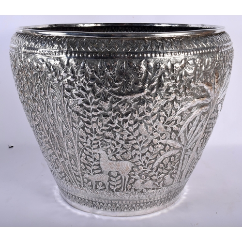 671 - A VERY LARGE LATE 19TH CENTURY INDIAN SILVER JARDINIERE decorative with animals and palm trees, amon... 