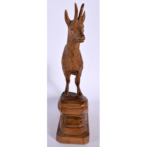 692 - AN ANTIQUE BAVARIAN BLACK FOREST CARVED WOOD FIGURE OF AN DEER. 21 cm x 10 cm.