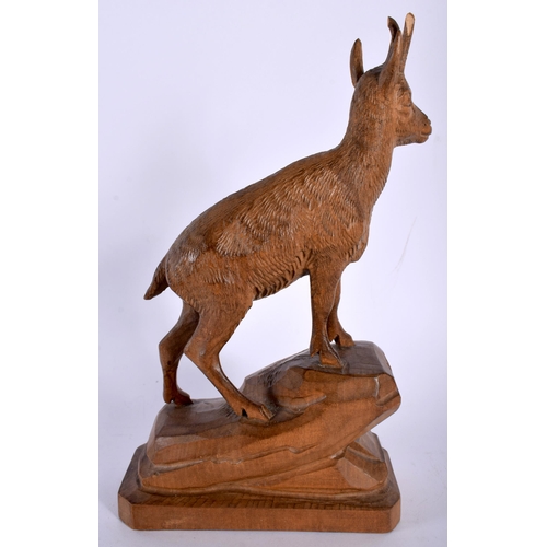 692 - AN ANTIQUE BAVARIAN BLACK FOREST CARVED WOOD FIGURE OF AN DEER. 21 cm x 10 cm.