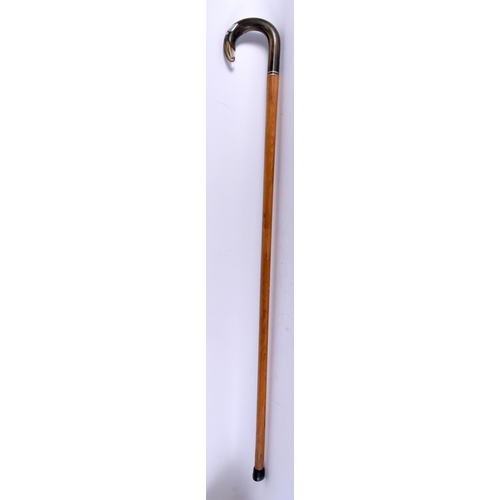 694 - A 19TH CENTURY CONTINENTAL SILVER HANDLED CANE together with others. Largest 90 cm long. (6)