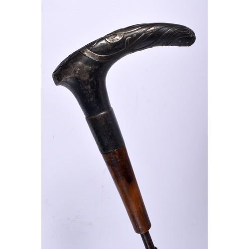 694 - A 19TH CENTURY CONTINENTAL SILVER HANDLED CANE together with others. Largest 90 cm long. (6)