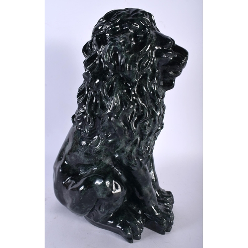 695 - A VERY LARGE ART DECO JADE PRESSED GLASS FIGURE OF A LION. 34 cm x 15 cm.