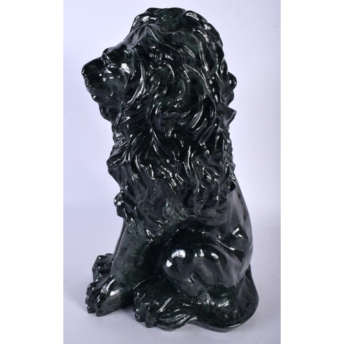 695 - A VERY LARGE ART DECO JADE PRESSED GLASS FIGURE OF A LION. 34 cm x 15 cm.