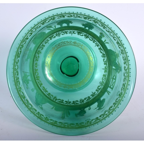 698 - A VENETIAN ENAMELLED GREEN GLASS BOWL painted with figures in landscapes. 14 cm x 14 cm.