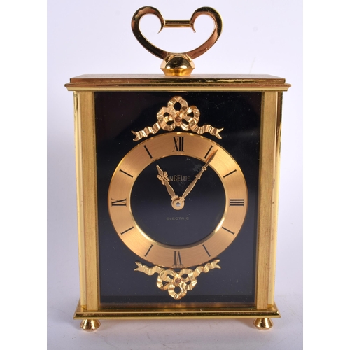 699 - AN ANGELUS GILT BRASS CLOCK. 14 cm high inc handle.