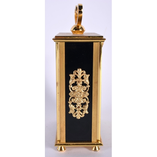 699 - AN ANGELUS GILT BRASS CLOCK. 14 cm high inc handle.