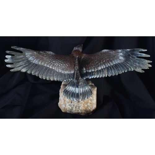 703 - AN ANTIQUE AUSTRIAN COLD PAINTED BRONZE FIGURE OF A BIRD upon a stone base. 32 cm wide.