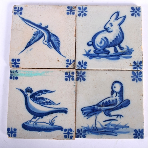 711 - FOUR 18TH CENTURY DELFT BLUE AND WHITE TILES. 13.5 cm square. (4)