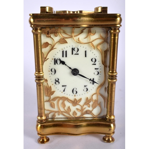 712 - A CASED ANTIQUE BRASS CARRIAGE CLOCK. 14.5 cm high inc handle.