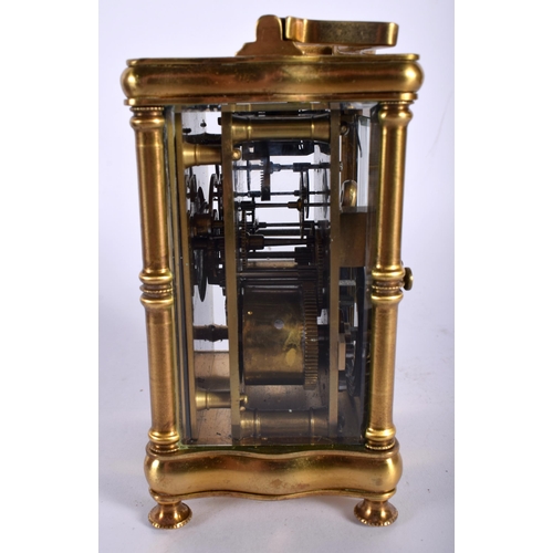 712 - A CASED ANTIQUE BRASS CARRIAGE CLOCK. 14.5 cm high inc handle.