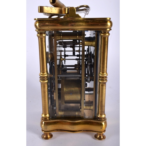 712 - A CASED ANTIQUE BRASS CARRIAGE CLOCK. 14.5 cm high inc handle.