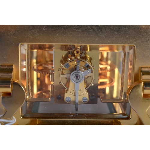 718 - A HALCYON DAYS BRASS CARRIAGE CLOCK. 15 cm high inc handle.