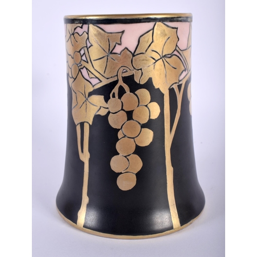 7 - AN ART NOUVEAU LIMOGES PORCELAIN TANKARD painted with grape vines. 14 cm high.