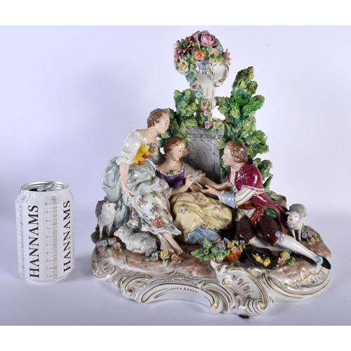 719 - A LARGE ANTIQUE CONTINENTAL PORCELAIN GROUP depicting lovers under a floral capped column. 33 cm x 2... 