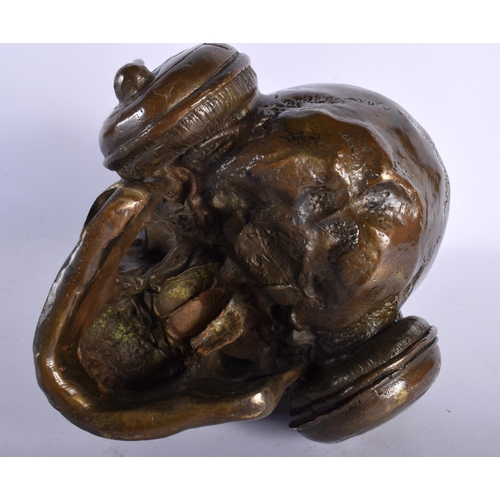 720 - A CONTEMPORARY BRONZE SKULL DJ. 18 cm wide.