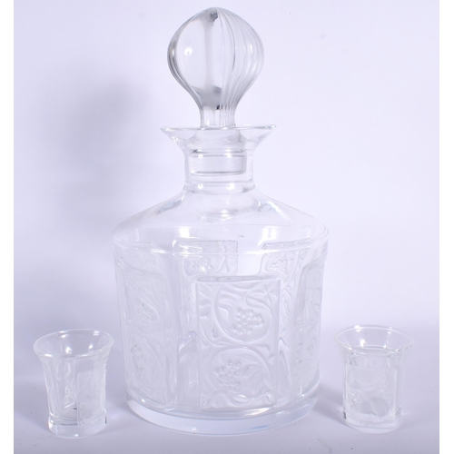 723 - A LARGE FRENCH LALIQUE GLASS DECANTER AND STOPPER together with two glasses. Largest 20 cm high. (3)