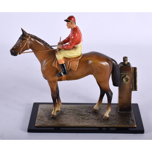 74 - AN EARLY 20TH CENTURY AUSTRIAN COLD PAINTED SPELTER EQUESTRIAN TABLE LIGHTER formed as a jockey. 18 ... 