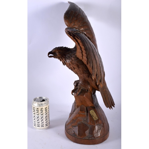 76 - A LARGE 19TH CENTURY BAVARIAN BLACK FOREST CARVED WOOD MODEL OF A HAWK modelled with arms outstretch... 