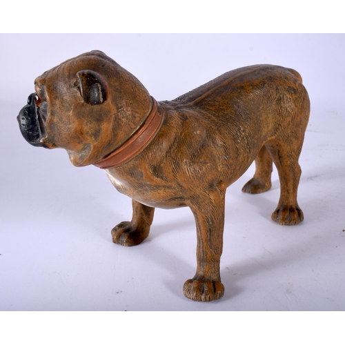 82 - A SMALL 19TH CENTURY AUSTRIAN COLD PAINTED TERRACOTTA DOG modelled with glass eyes. 18 cm x 15 cm.