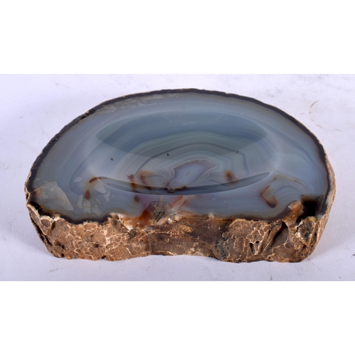 89 - A NATURAL HISTORY AGATE CARVED OVAL DISH of naturalistic form. 15 cm x 11 cm.