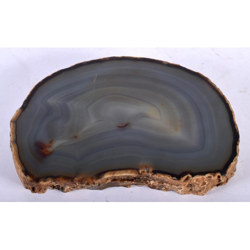 89 - A NATURAL HISTORY AGATE CARVED OVAL DISH of naturalistic form. 15 cm x 11 cm.