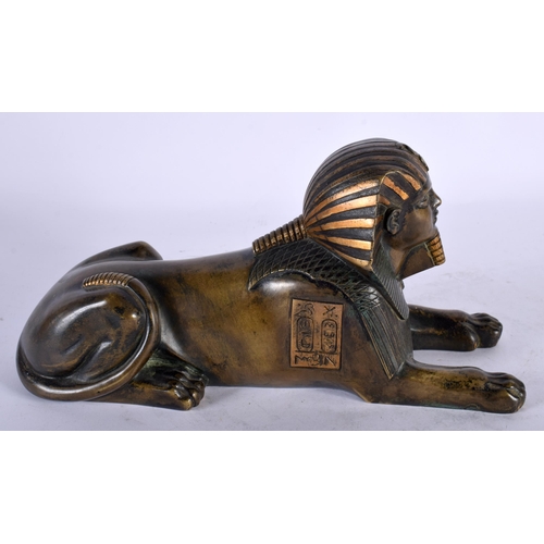 90 - A 19TH CENTURY FRENCH EGYPTIAN REVIVAL BRONZE FIGURE OF A SEATED SPHINX After the Antiquity. 26 cm x... 
