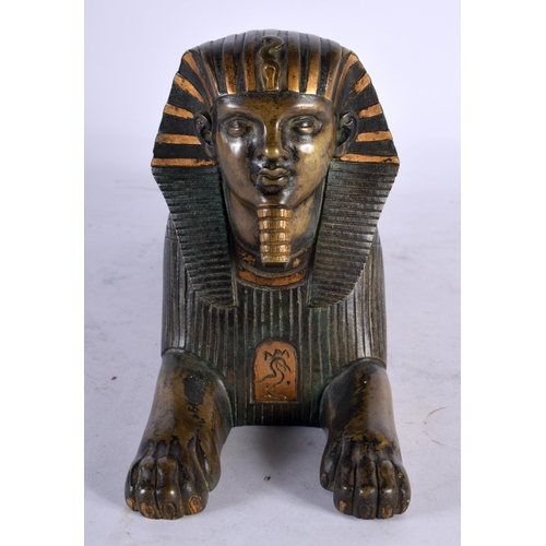 90 - A 19TH CENTURY FRENCH EGYPTIAN REVIVAL BRONZE FIGURE OF A SEATED SPHINX After the Antiquity. 26 cm x... 