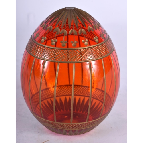 96 - A FABERGE GLASS EGG. 9.5 cm x 5 cm.